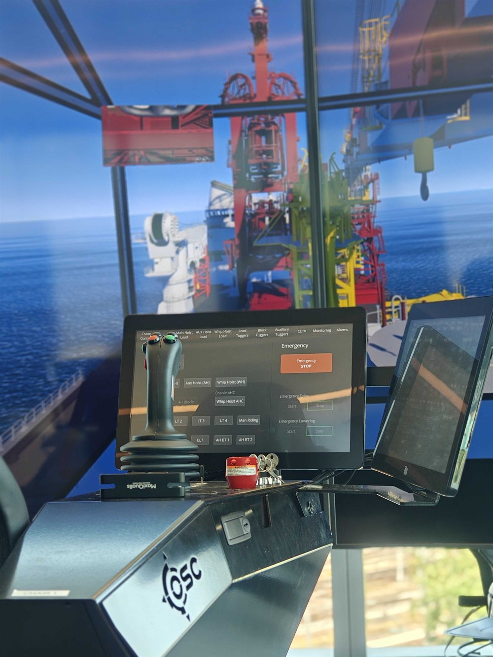 Crane control station facing a pipelay vessel tower Crane control station facing a pipelay vessel tower